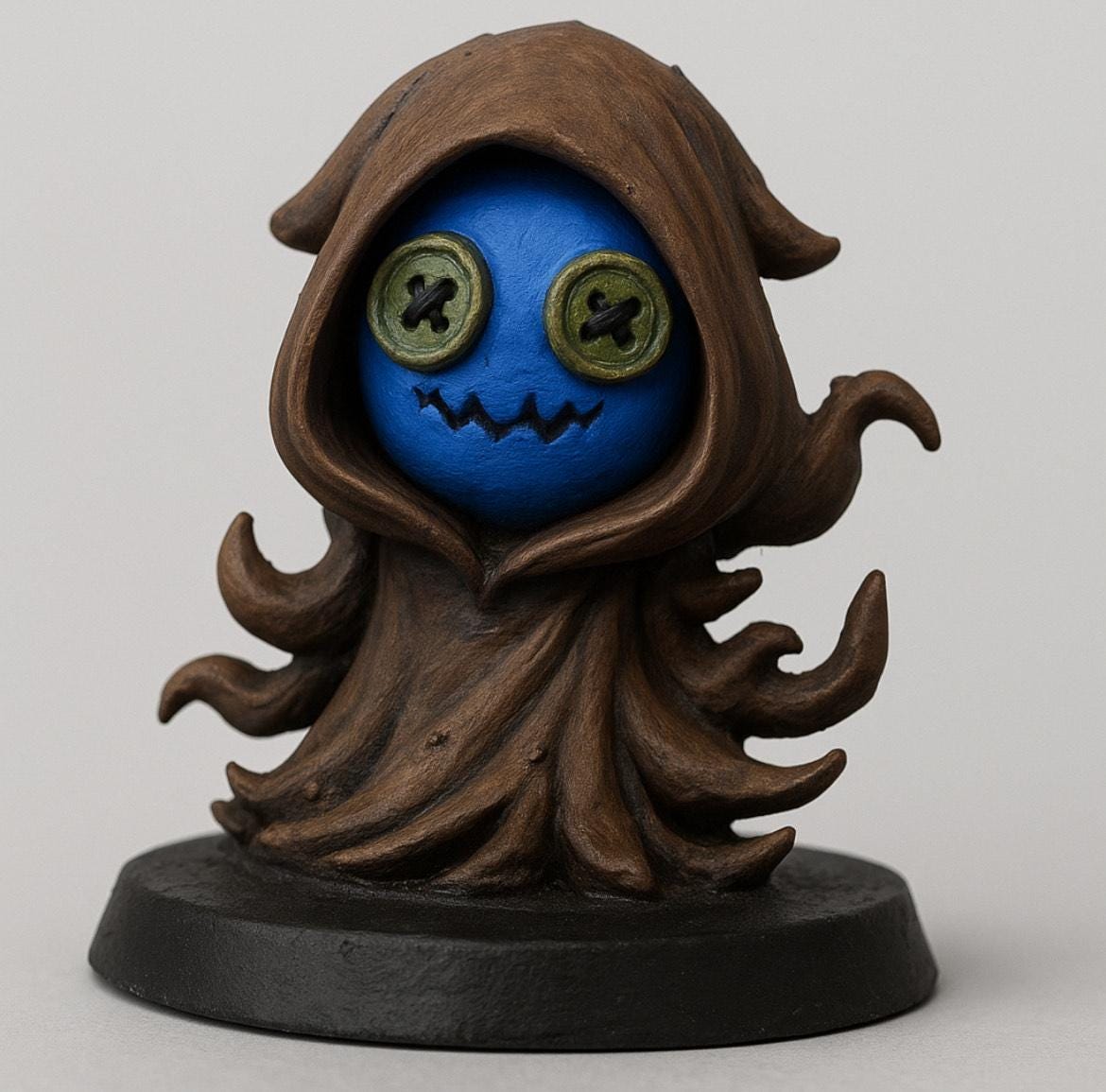 Cloaked doll figurine